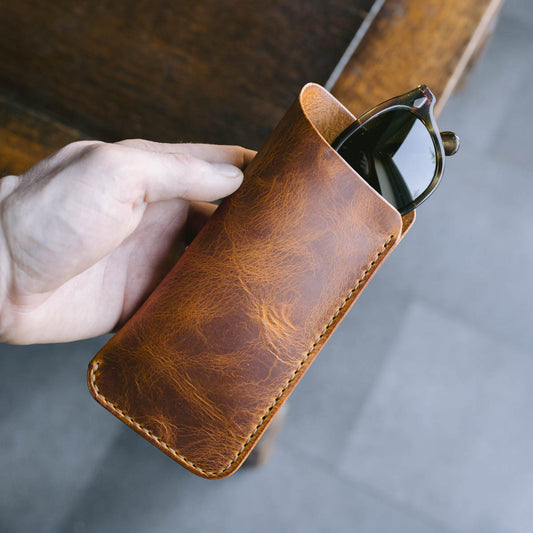 Sunglasses in the Napoli brown and yellow leather slip case