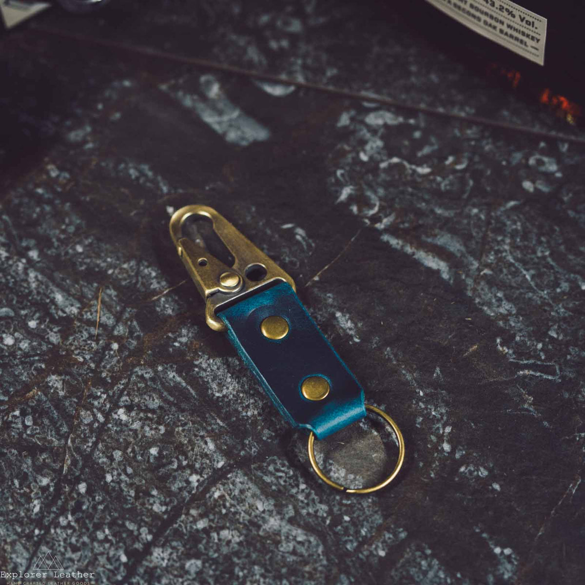 Blue leather key ring with brass clip