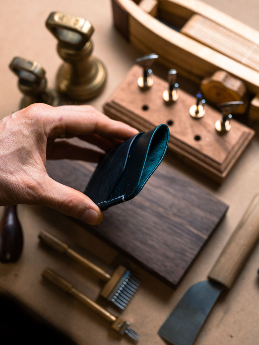 Three pocket card holder held open