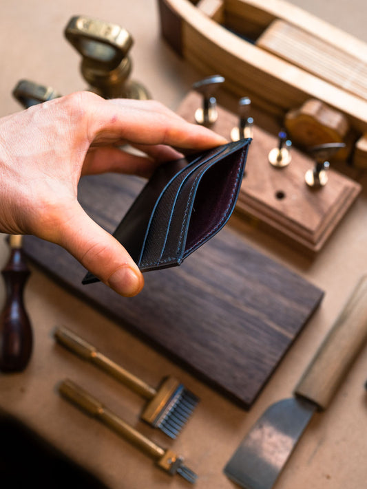 Side profile of five pocket navy card holder