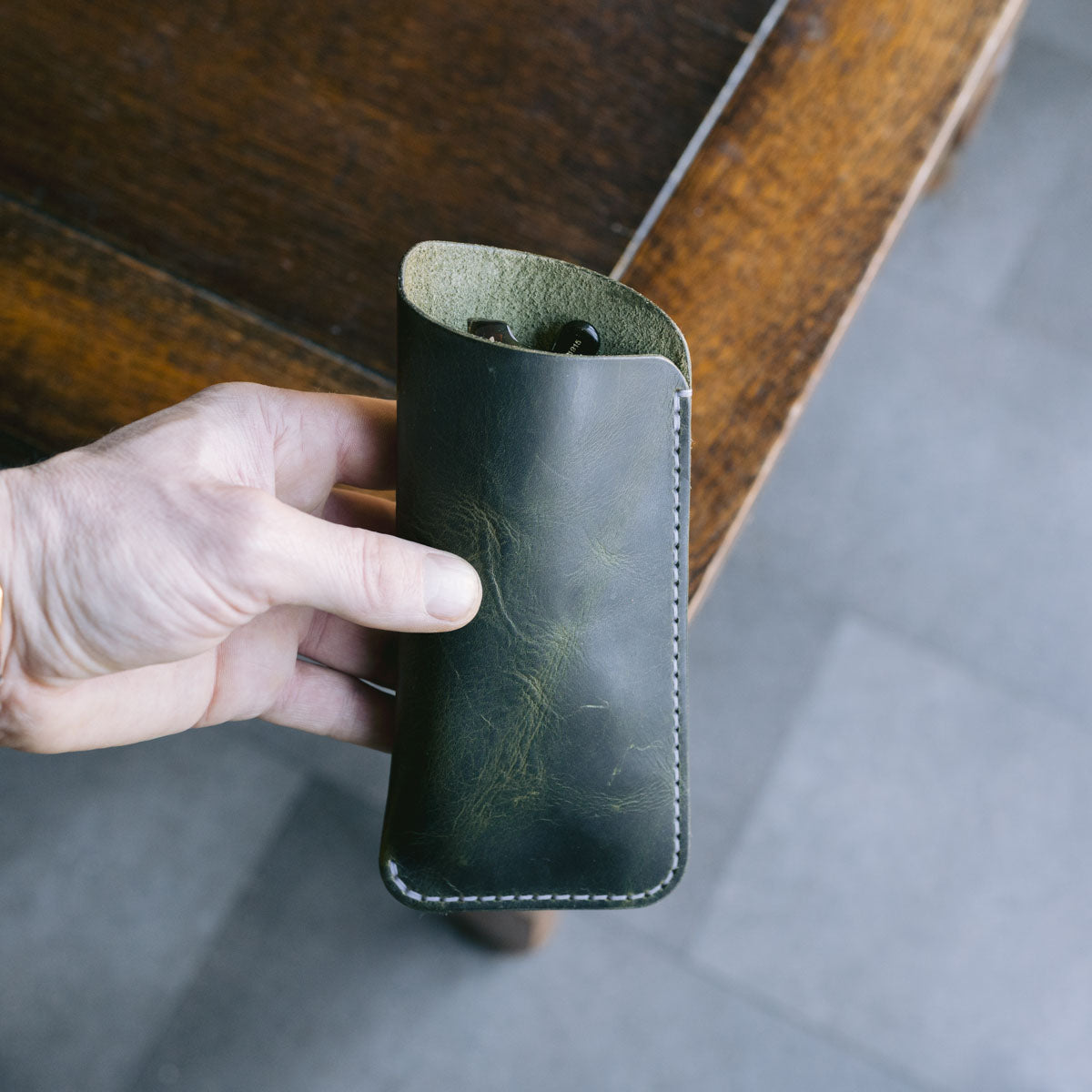 Olive green leather glasses slip case with glasses inside