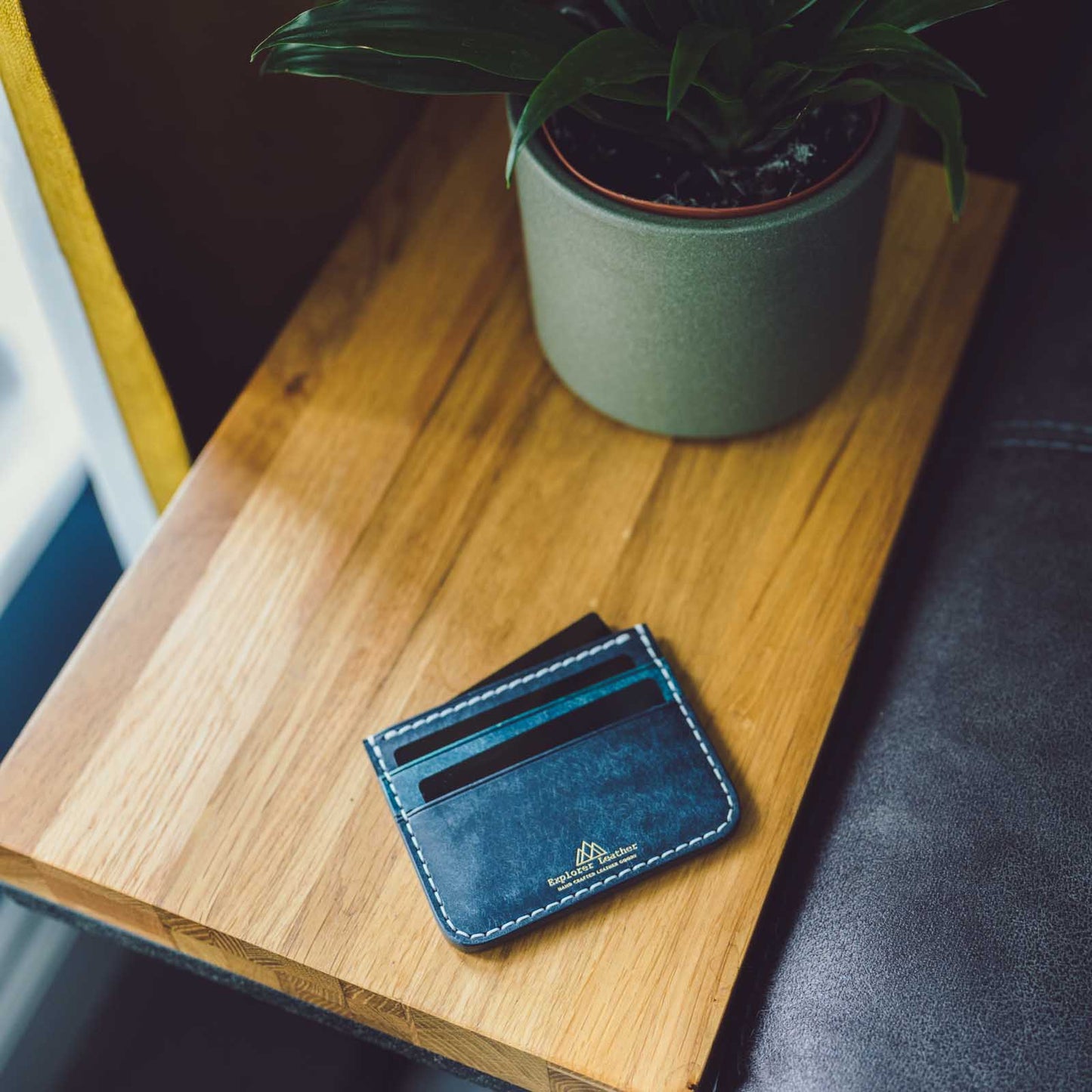 navy and nazionale 5 pocket card holder on table