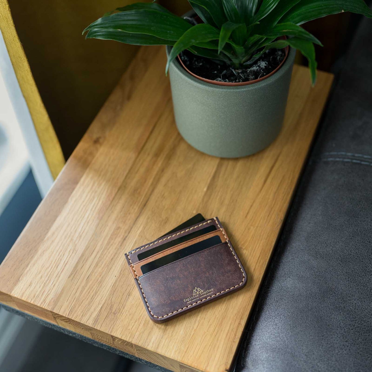 Tabacco and cognac card holder on table