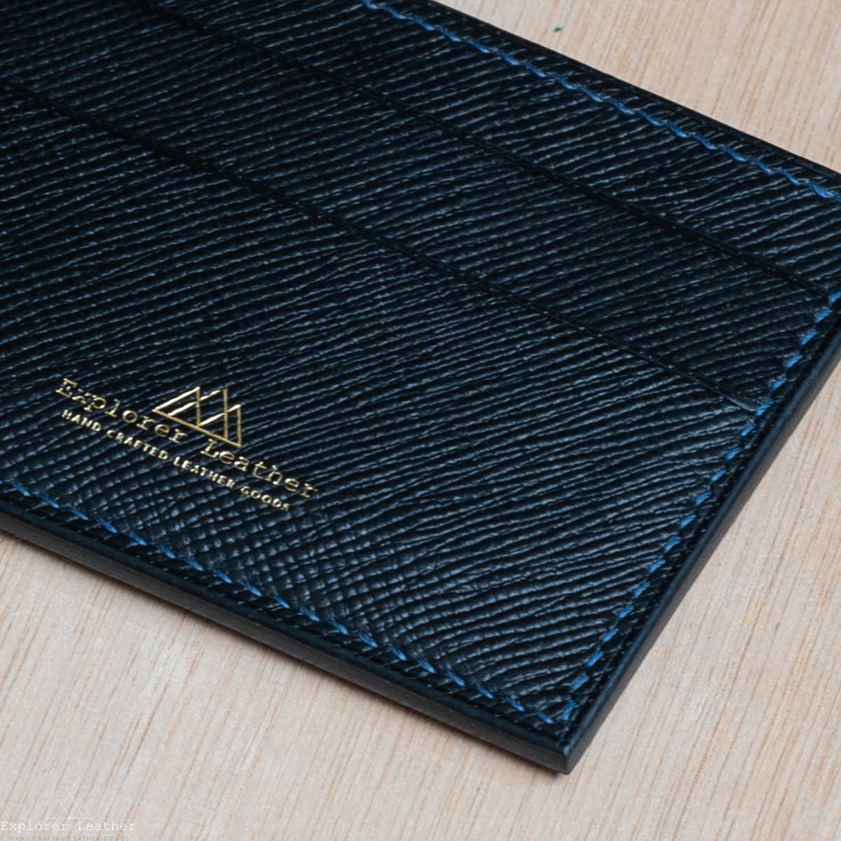 Black, five pocket, card holder, hatch grain, pebble grain. full grain, italian leather, navy blue stitching, close up detail