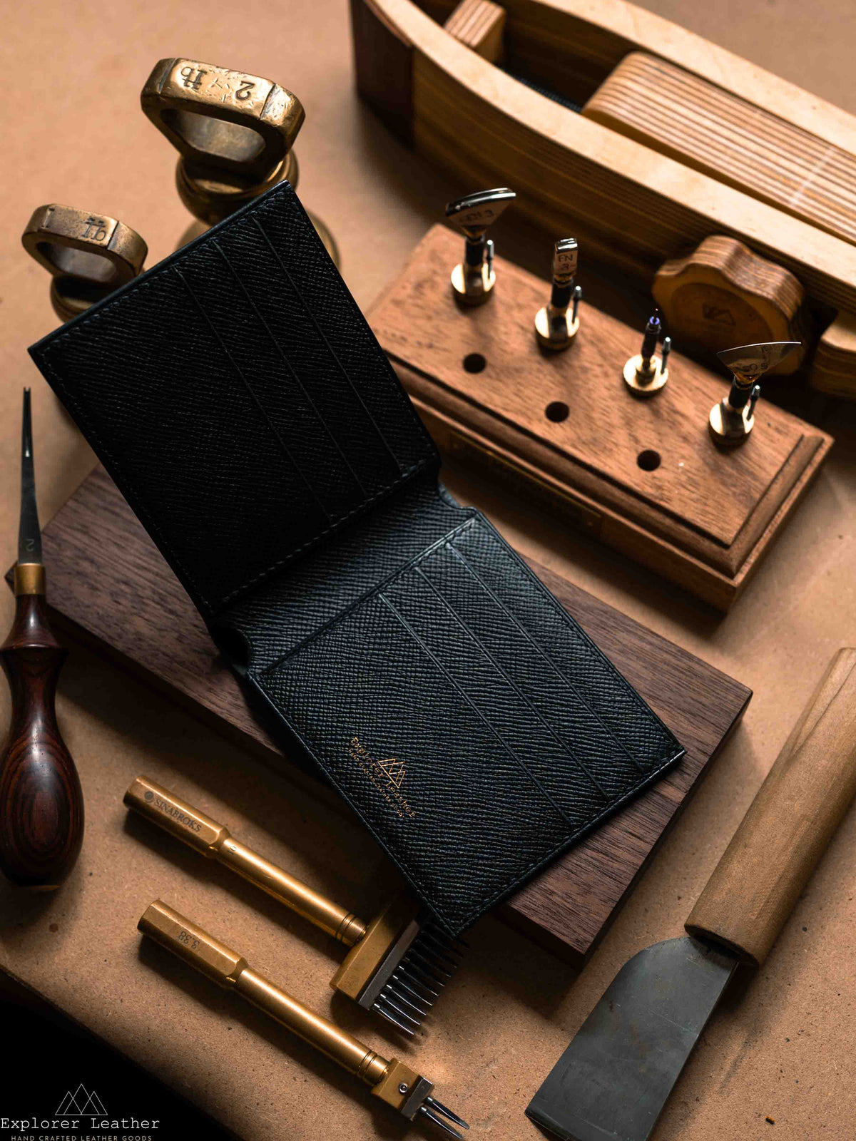 Open black leather bifold wallet showing card slots