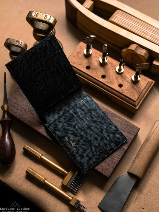 Open black leather bifold wallet showing card slots