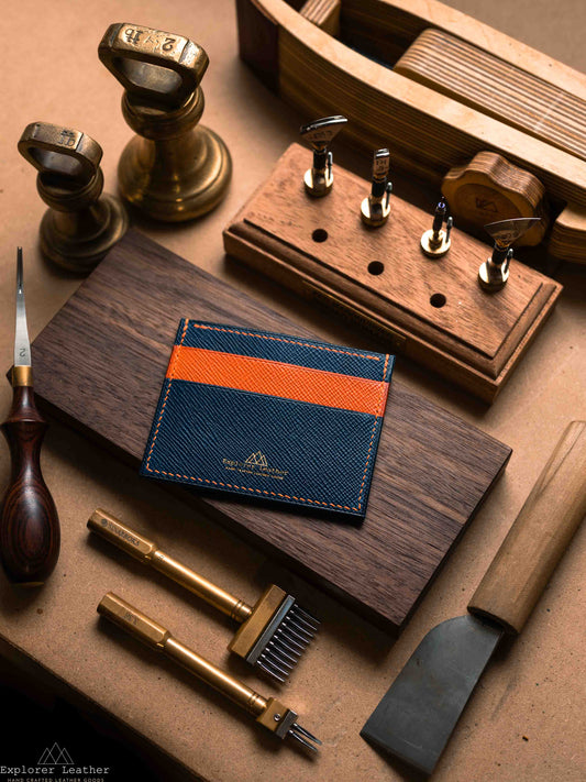 Navy and orange five pocket card holder on a workbench