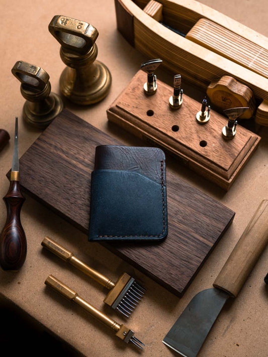 Three pocket leather card holder on a workbench