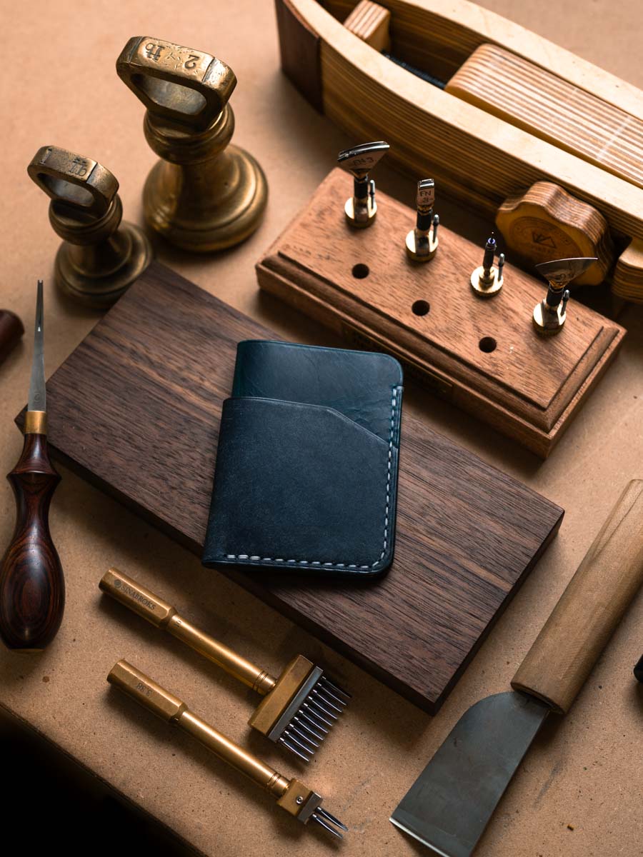Three pocket leather card holder on a workbench