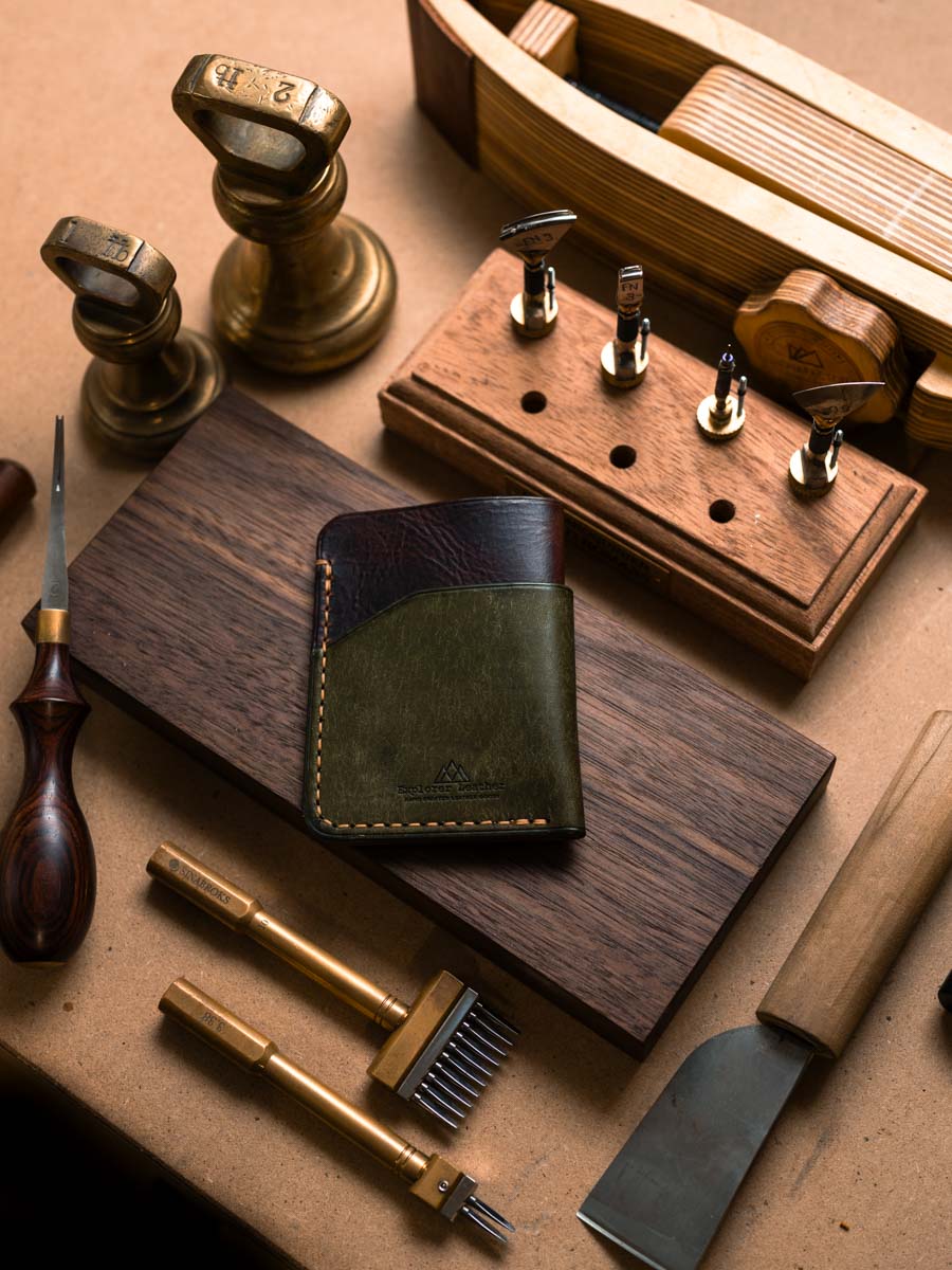 Front of three pocket card holder with olive panel