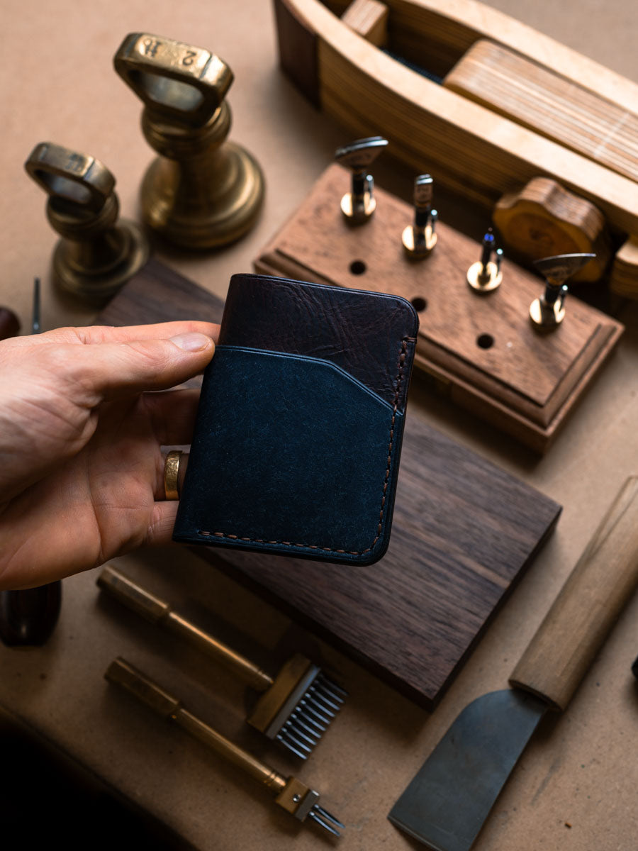 Three pocket card holder held in hand