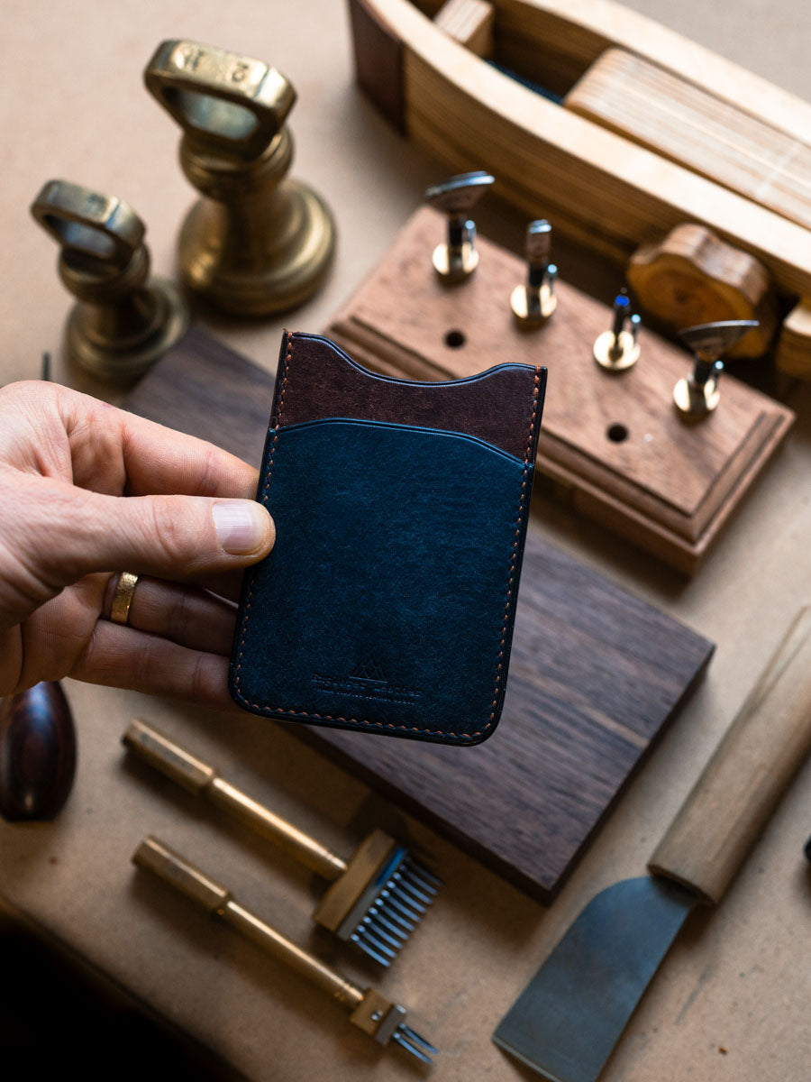 Three pocket card holder held in hand
