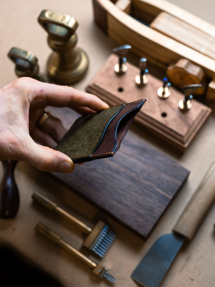 Three pocket card holder opened to show the pockets