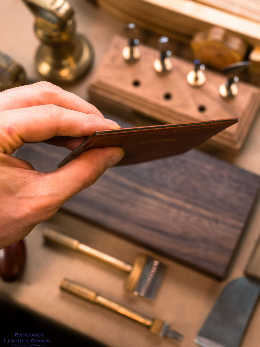 Slim edge profile of the cognac and olive five pocket leather card holder